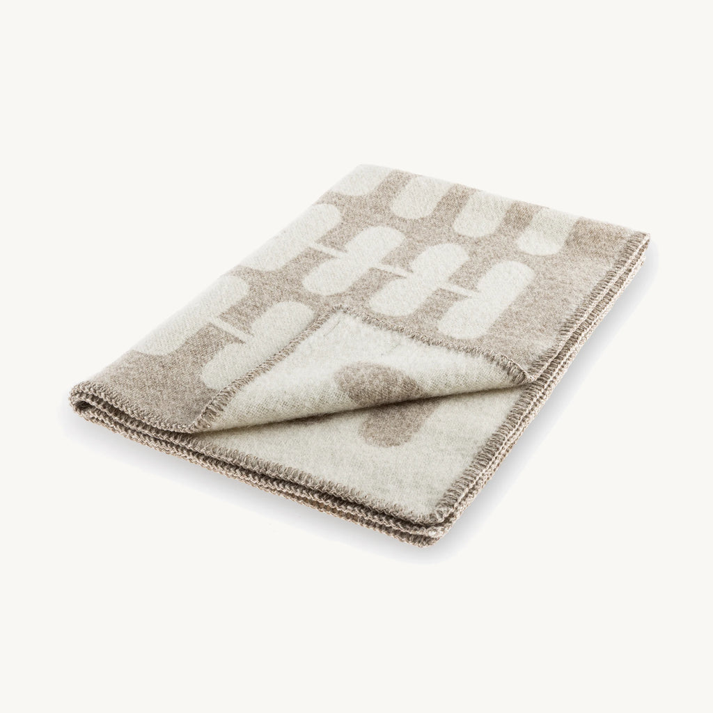 Flora – couverture en laine pliée, motif floral cappuccino et naturel – Maison Canisya