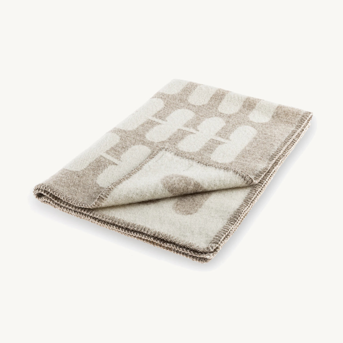 Flora – couverture en laine pliée, motif floral cappuccino et naturel – Maison Canisya