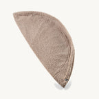 Housse pouf Senso MiaCara coloris greige pliée sur fond studio — Maison Canisya